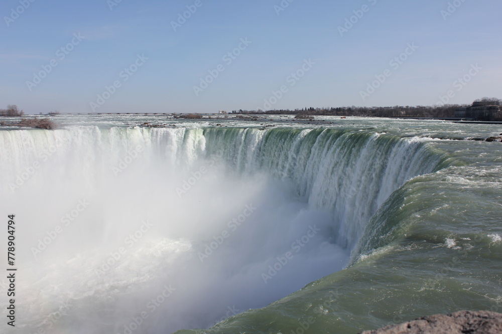 Dramatic Niagara Falls Canadian side on a sunny day Dramatic Niagara Falls Canadian side on a sunny day