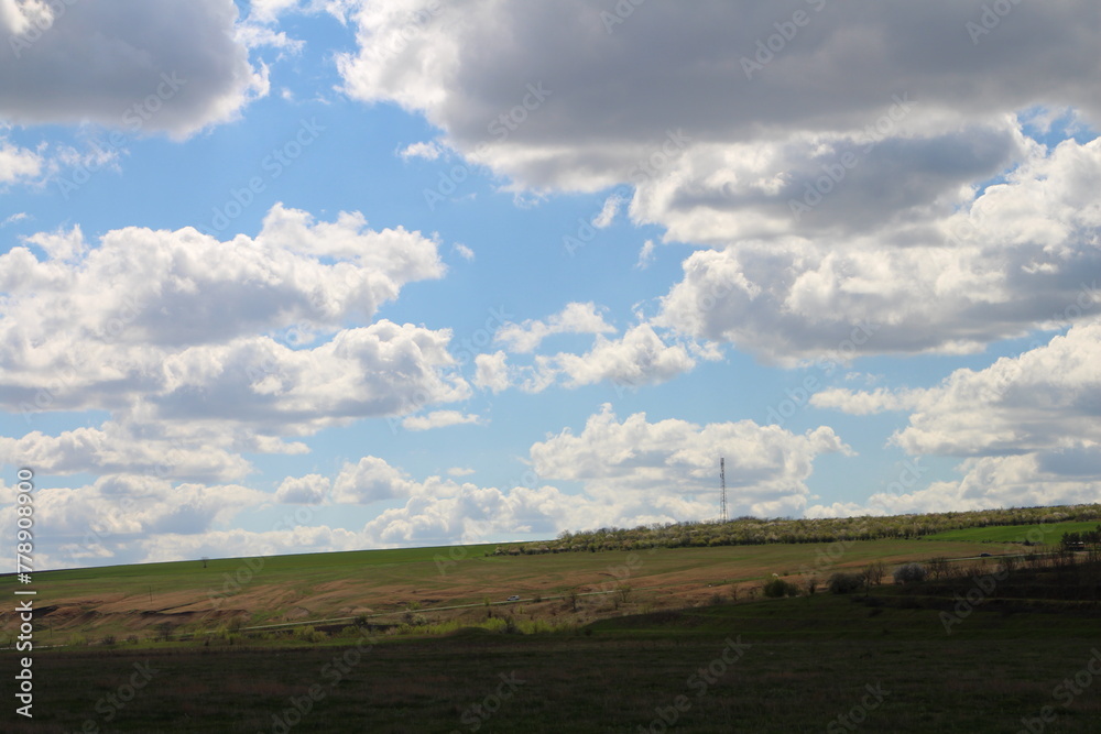 A field with a few clouds
