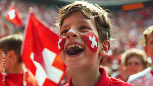 Elated Young Fan with Swiss Flag Face Paint at a Sporting Event