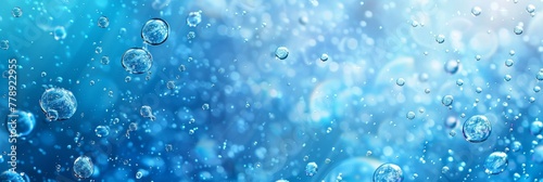 Water Droplets with Bokeh and Light Flares on Blue