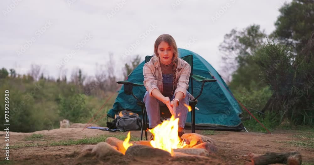 Fire, woman and camping wood with flames for heating hands and calm in nature with a tent. Adventure, field and rocks in a campsite with smoke, burning and pit with travel and holiday in a park Fire, woman and camping wood with flames for heating hands and calm in nature with a tent. Adventure, field and rocks in a campsite with smoke, burning and pit with travel and holiday in a park
