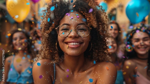 Joyful young woman with glitter on her face enjoying a summer festival party outdoors.