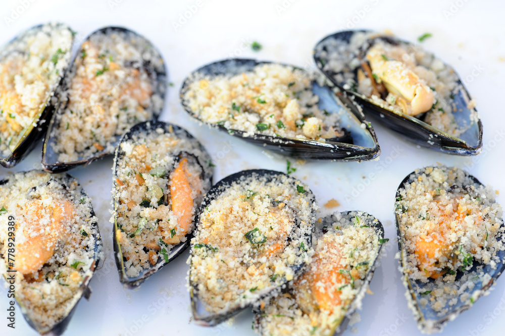 Moscioli or Cozze del Conero Ancona roasted with marinara sauce with garlic parsley and chili pepper Moscioli or Cozze del Conero Ancona roasted with marinara sauce with garlic parsley and chili pepper