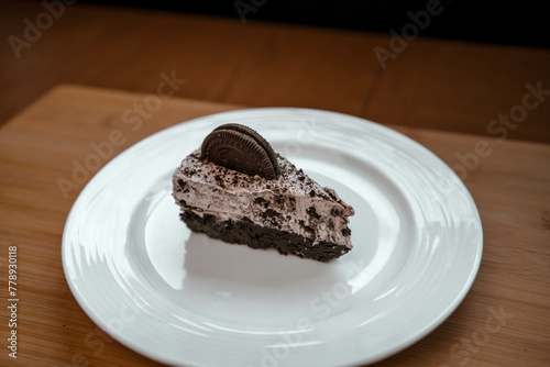 A slice of cookies and cream cheesecake on a plate photo