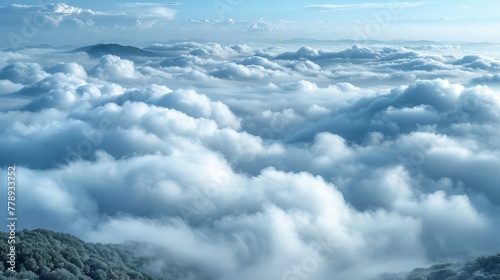   A panoramic view of numerous clouds against the backdrop of a majestic mountain range