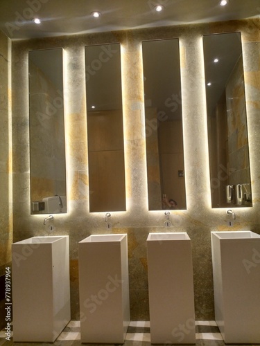 Detail of modern bathroom mirrors with stone sink