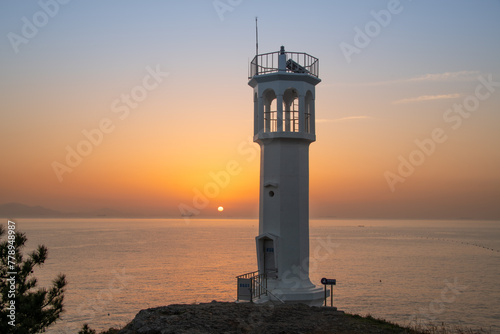 Beach and lighthouse with sunrise view 