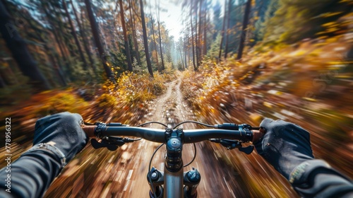 First-person view of a mountain biker speeding through a sun-dappled forest trail. POV concept photo