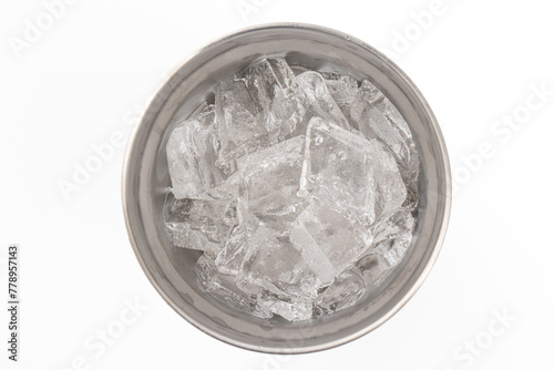 Top view of Ice in a blue stainless steel cold storage glass on a white background.