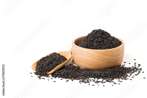 Poppy seeds in a wooden cup and poppy seeds in a wooden spoon. isolated on white background.