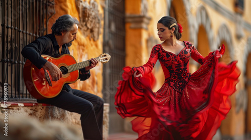 Flamenco dancer in a vibrant red dress performing with passion, accompanied by a guitarist against a warm, rustic backdrop, capturing the essence of Spanish culture. photo