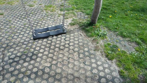 Slow-motion of empty swing playground