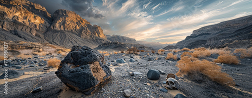 A panoramic view of an alien-like landscape at sunset, featuring towering rocky formations and golden vegetation. photo