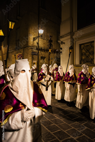 Hooded penitents during the famous Good Friday procession in Chieti (Italy) with the luminous lantern