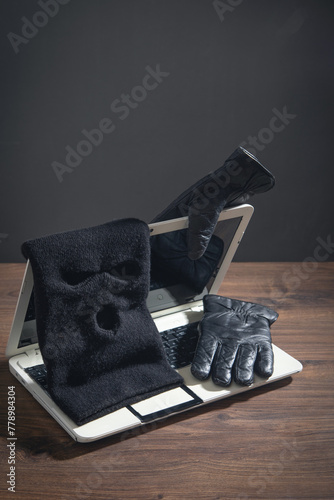 Fototapeta Naklejka Na Ścianę i Meble -  Mask, gloves and laptop computer on the table.