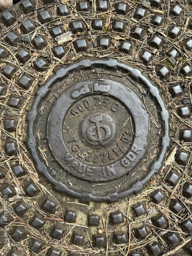 beautiful metal manhole cover from the GDR era