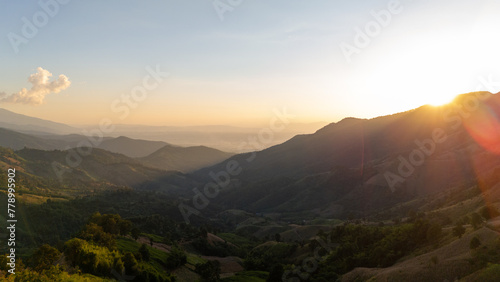 Aerial view of mountain and roadway, Beautiful landscape sunset with .golden sunlight. © black_J