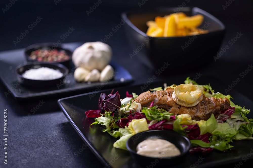 Duck breast with salad and baked goat cheese Duck breast with salad and baked goat cheese