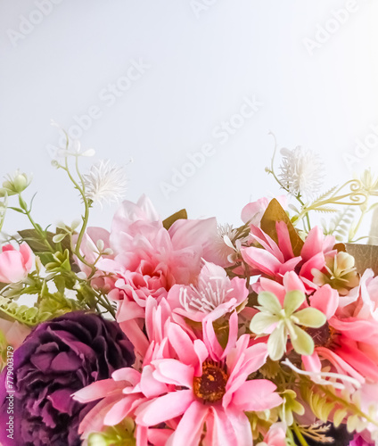 Light pink floral arrangement closeup with Copy space on light background 