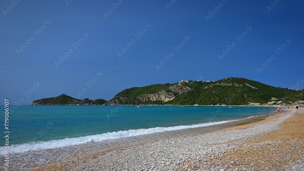 Beautiful beach with sea, sun and blue sky. Concept for travel and summer vacation. Greece-island of Corfu. Agios Georgios beach.