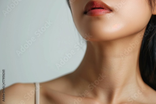 Young asian Woman over close up on white background. Skin care beauty, hardware cosmetology, rejuvenation concept. Lips correction. 