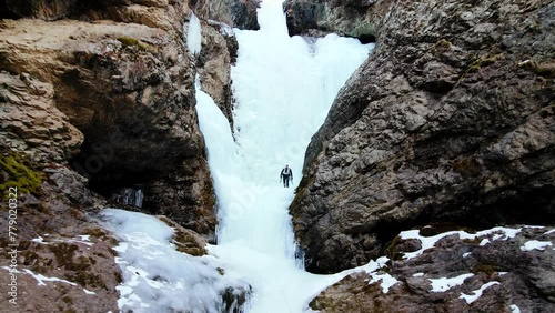 Ice climbing at frozen waterfall. photo