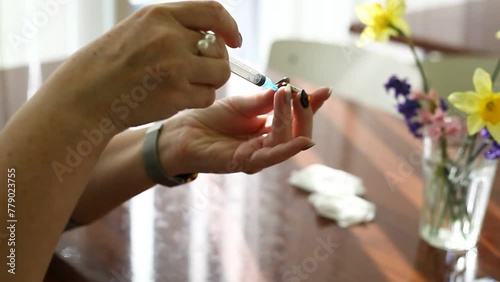 the girl doctor opens a pack of syringe for injection