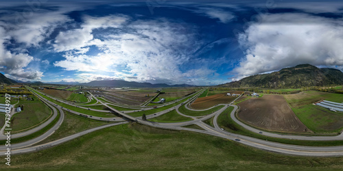 Aerial 360 Panorama of Highway, Farms and Mountain Landscape.