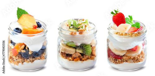 Variety of healthy greek yogurt and fruit parfaits in mason jars isolated on a white background. Peach blueberry, kiwi banana and strawberry banana.