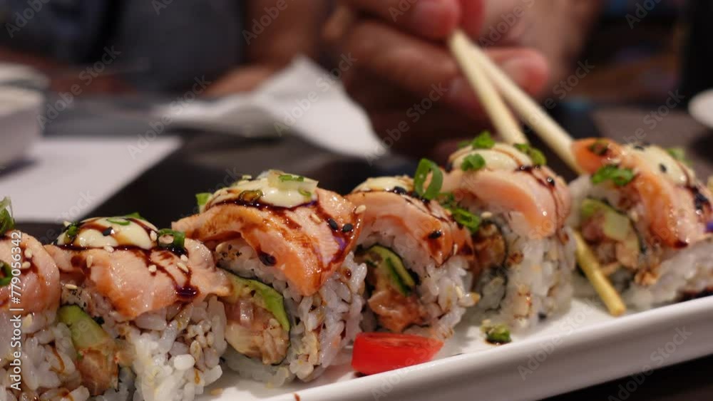 Japanese food salmon avocado maki sushi roll chopsticks eating 4k Japanese food salmon avocado maki sushi roll chopsticks eating 4k