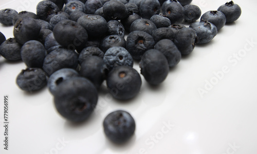 blueberries on a plate. group of blueberries. natural food. set of small fruits. food with selective focus. © Mauri