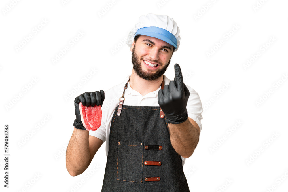 Butcher man wearing an apron and serving fresh cut meat over isolated chroma key background doing coming gesture Butcher man wearing an apron and serving fresh cut meat over isolated chroma key background doing coming gesture