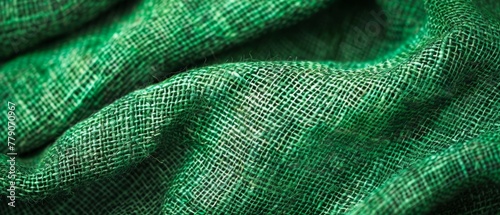 High-resolution image of folded green burlap, emphasizing the texture and depth, suitable for detailed backgrounds. Burlap fabric texture - background