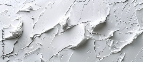 Detailed view of a wall entirely coated in white paint, showing thick layers and texture.