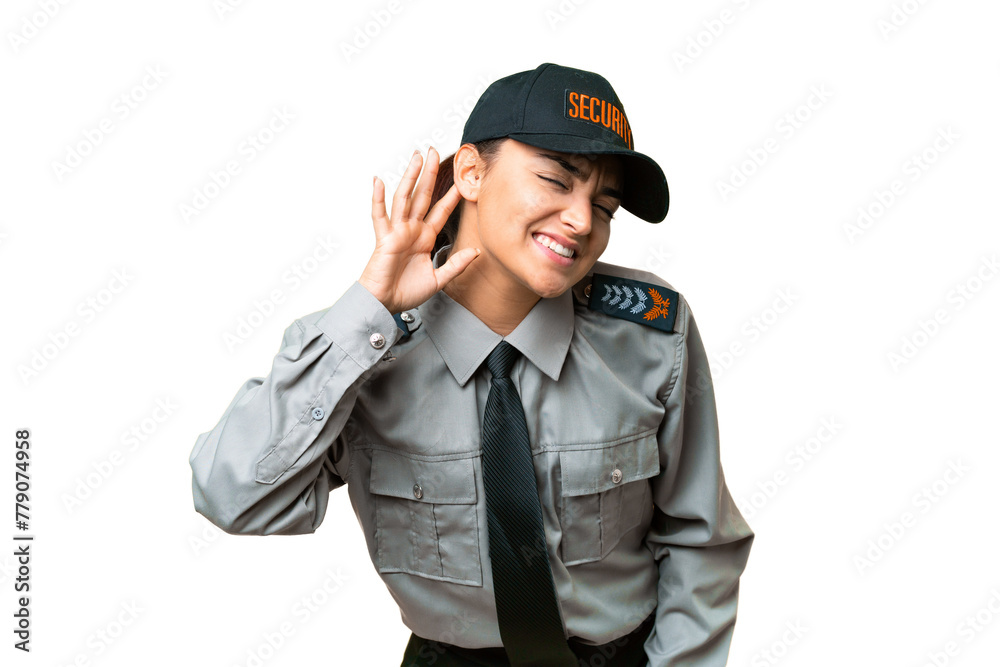 Young safeguard woman over isolated chroma key background listening to something by putting hand on the ear Young safeguard woman over isolated chroma key background listening to something by putting hand on the ear