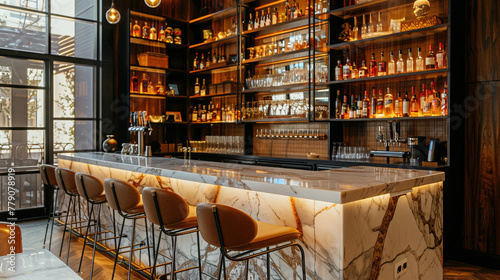 A modern home bar with a marble countertop, high stools, and shelves stocked with various spirits and glassware.