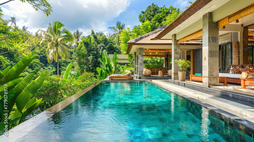 A lavish home overlooking a peaceful garden from the poolside.