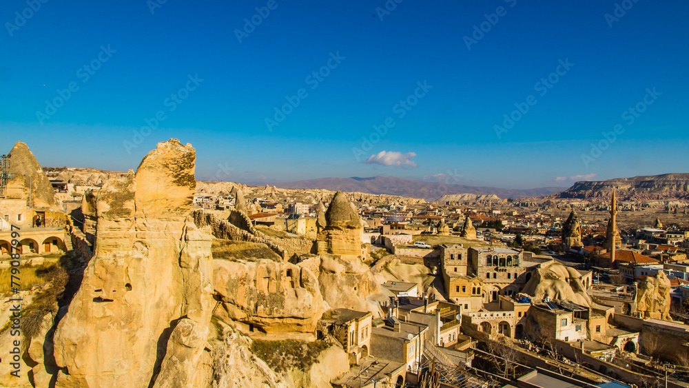 Fototapeta premium Göreme, Turkey - March 21 2014: Cone shaped Rock formation so called fairy Chimneys in Paşabağ Valley of Cappadocia