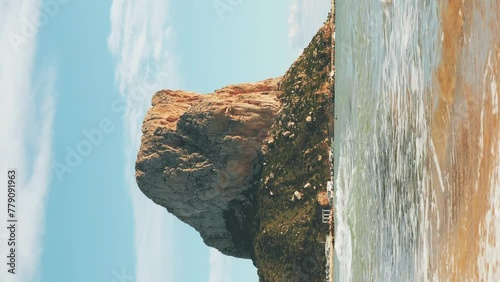 Penyal d'Ifac Natural Park. Seashore of Mediterranean Sea. Vertical video photo