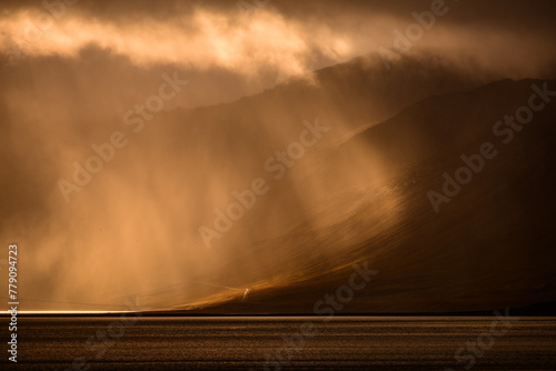 Dramatic morning light filtering through the clouds in Dyrafjördur, Westfjords, Iceland. © Pedro