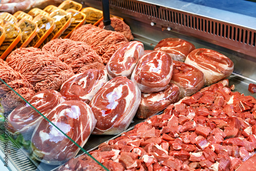 Steak, meat and minced meat display in the butcher section of the market