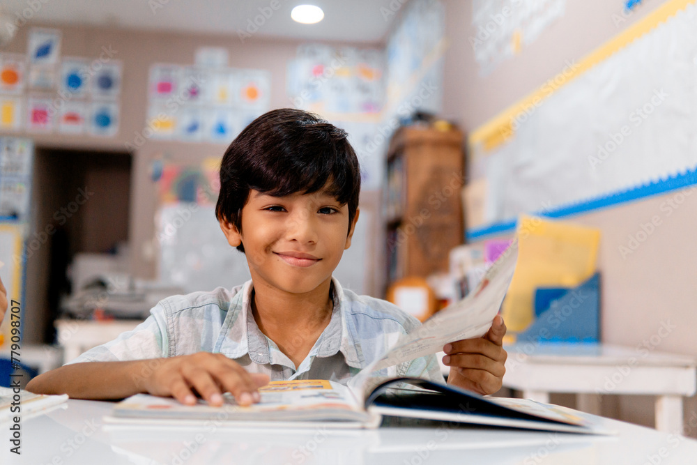 Portrait of latin american elementary child in a classroom. Portrait of latin american elementary child in a classroom.