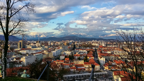 Breathtaking aerial view of Ljubljana, Slovenia, Europe. Looking from renowned Ljubljana Castle, an architectural masterpiece. Snow capped mountain peaks of Karawanks and Julian Alps in background photo