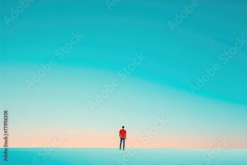 A man stands alone on a beach, looking out at the ocean