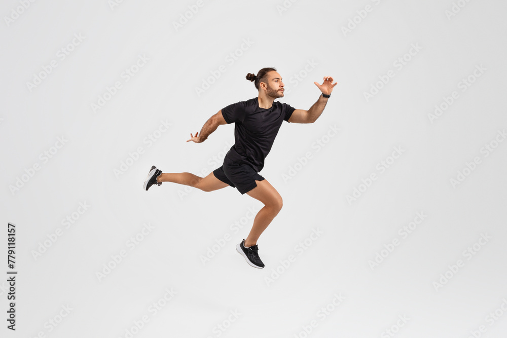 Man running in mid-air on white background