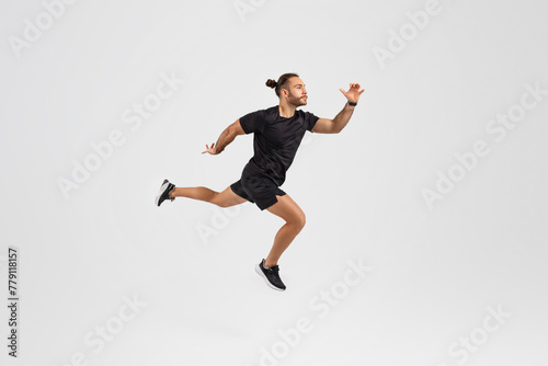 Man running in mid-air on white background