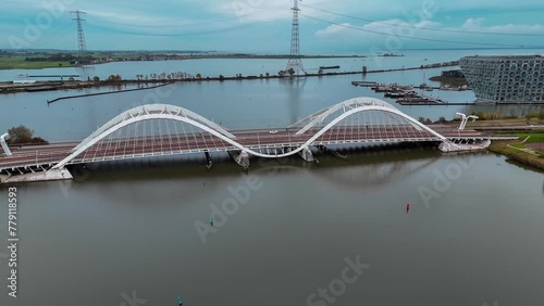 Aerial drone view of modern Enneus Heerma Bridge Amsterdam Netherlands. High quality 4k footage photo