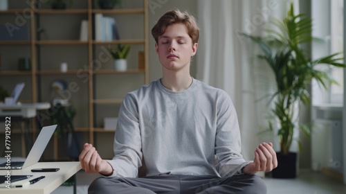 Man Meditating in Cozy Room photo