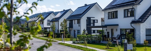 A row of charming houses adorned with solar panels on their roofs, harnessing the power of the sun to generate sustainable energy