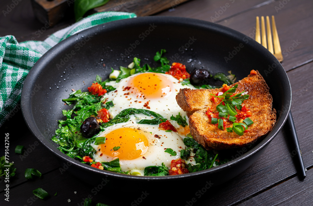 Keto breakfast. Fried eggs with spinach and toast. Keto breakfast. Fried eggs with spinach and toast.